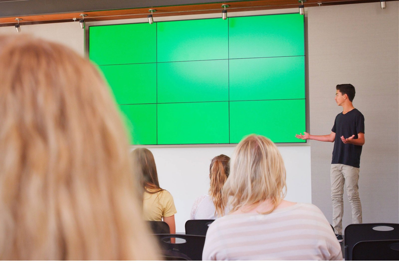 male-teacher-giving-presentation-to-high-school-or-2024-12-12-03-02-10-utc