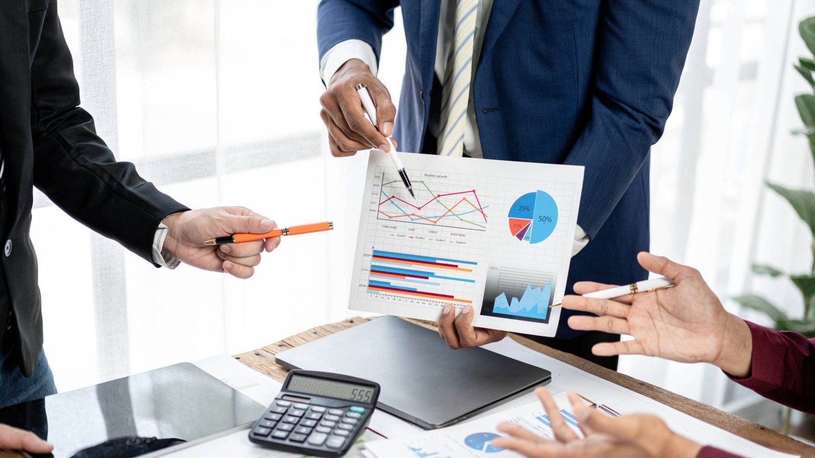 a-group-of-people-are-gathered-around-a-table-with-2025-01-09-04-26-47-utc